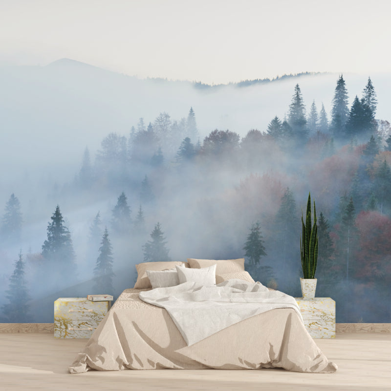 Forest wallpaper transforming a home office with morning mist and pine trees