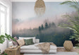 Misty forest wallpaper creating depth in modern living room, morning light filtering through pine trees