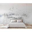 Misty forest wallpaper creating depth in a modern bedroom, morning light filtering through the pine trees and birds