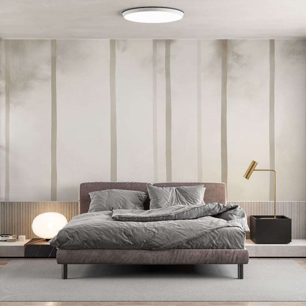 Minimalist forest wallpaper creating a serene atmosphere in a modern Scandinavian living room with natural light