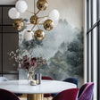 Misty forest wallpaper creating depth in a modern living room with grey furniture and natural light