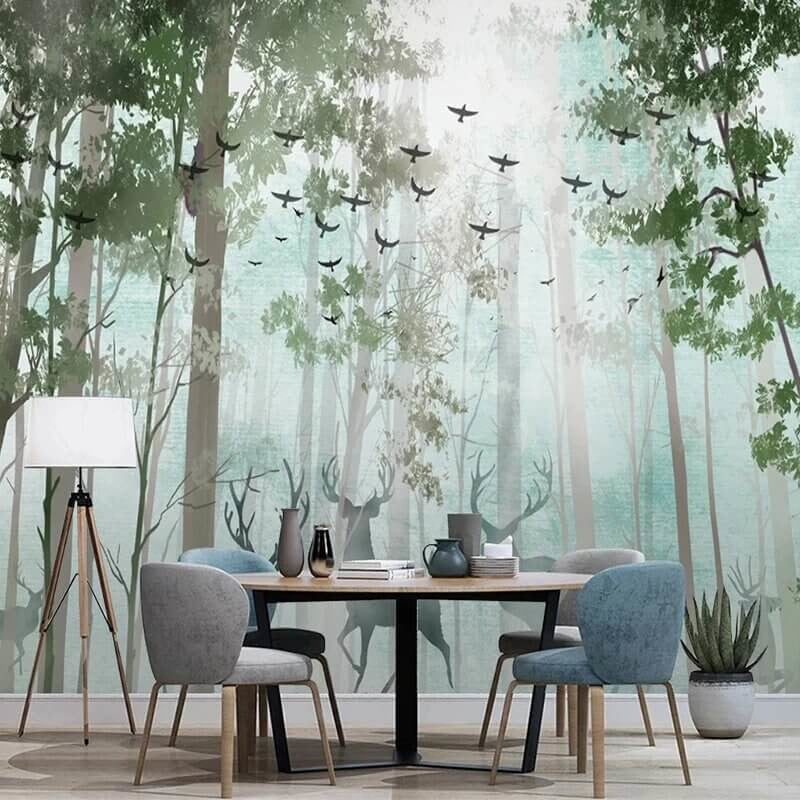 Forest mural wallpaper with misty trees and deer creating a calm atmosphere in a modern living room setting