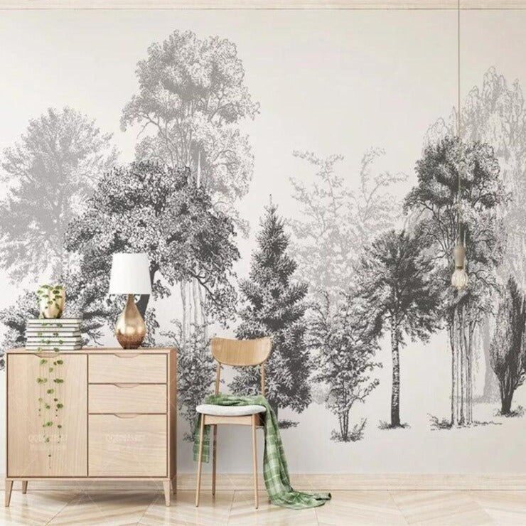 Black and white forest wallpaper creating depth in a modern living room with minimalist furniture