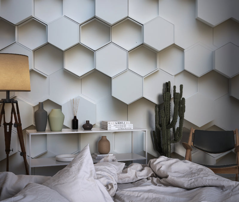 Bedroom with white 3D geometric wallpaper creating a calm, modern atmosphere
