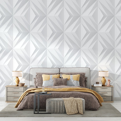 Modern white 3D geometric wallpaper in a minimalist living room creating depth and visual interest