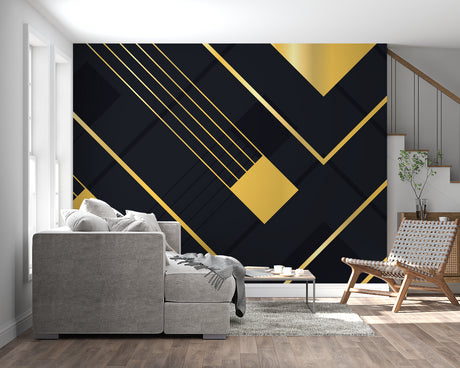 Geometric black and gold wallpaper in modern living room with grey sofa and metal accents