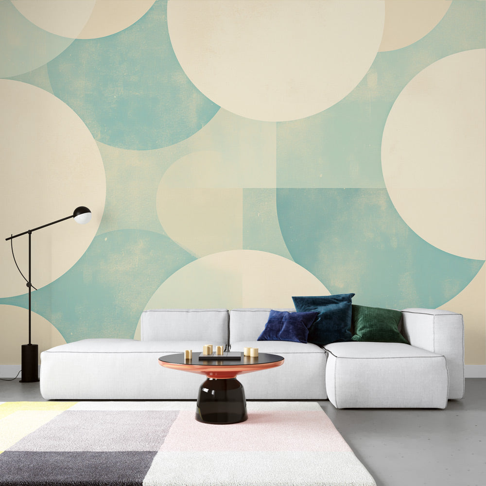 Geometric Art Deco wallpaper with pastel blue circles creating a modern look in a bright living room setting