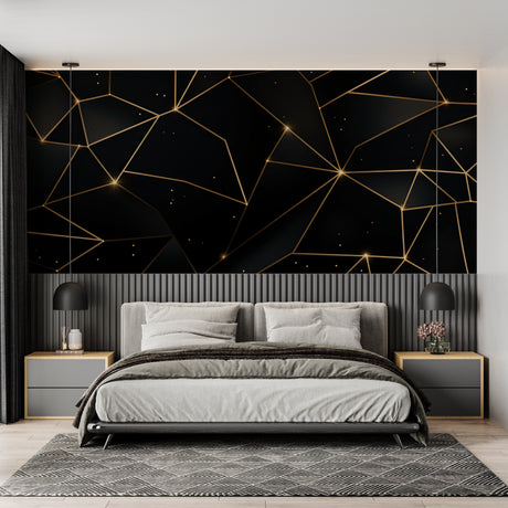 Black and gold geometric wallpaper in modern living room showing angular pattern catching natural light