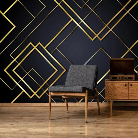 Geometric black and gold wallpaper in modern living room setting with minimal furniture and tall windows