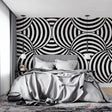 Modern black and white geometric wallpaper in minimalist living room creating dramatic focal wall