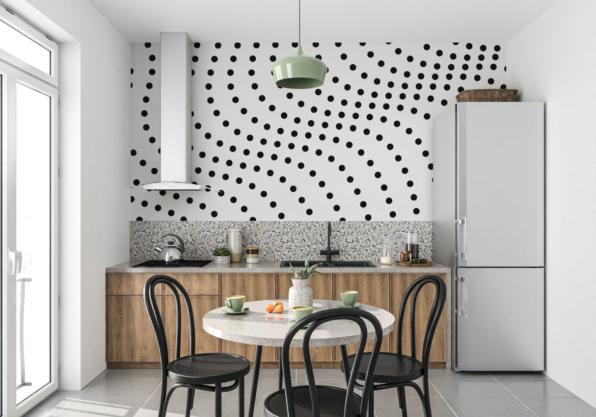 Black and white dot pattern transforming a dining room wall