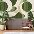 Green geometric circle wallpaper in modern living room creating depth and visual interest