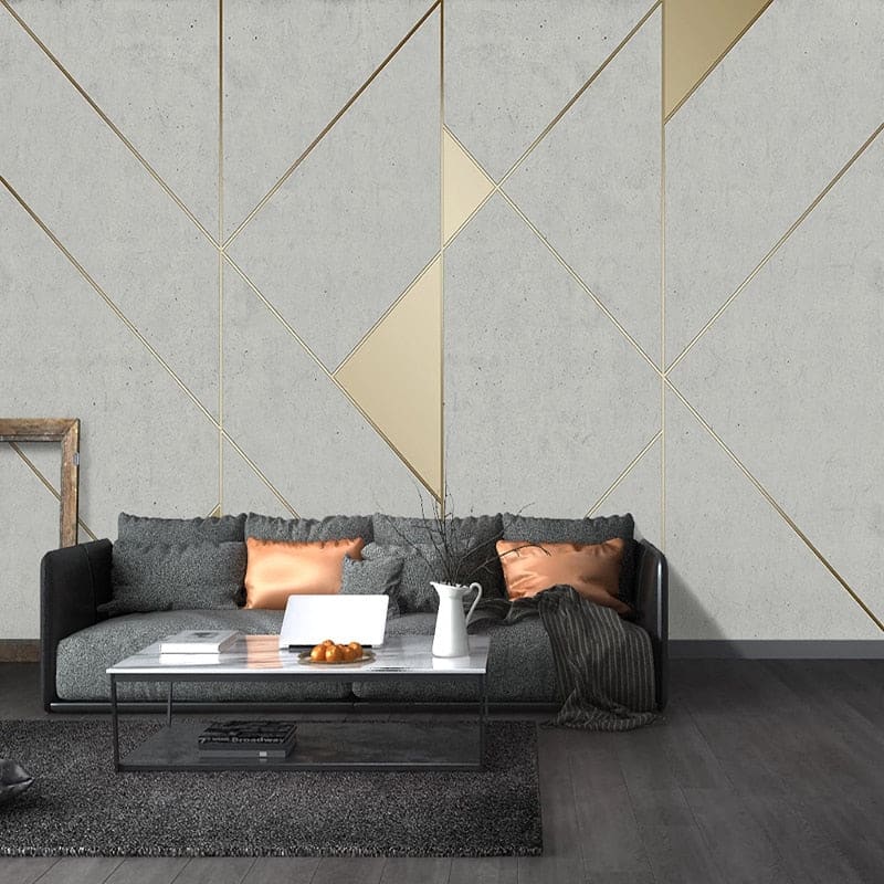Geometric art deco wallpaper in modern living room showing grey and gold pattern creating depth