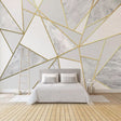 Geometric marble and gold wallpaper in modern living room creates luxury hotel atmosphere