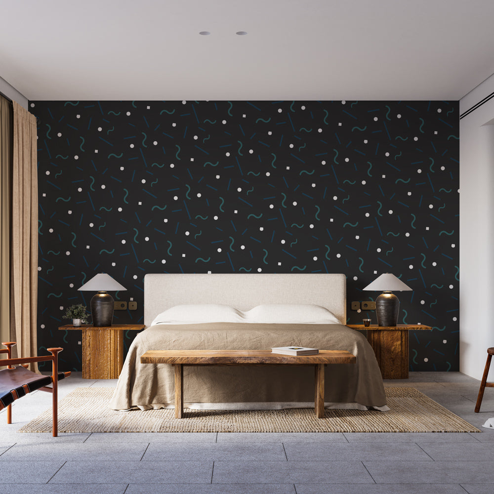 Modern geometric wallpaper showcased in a minimalist living room with black furniture and large windows