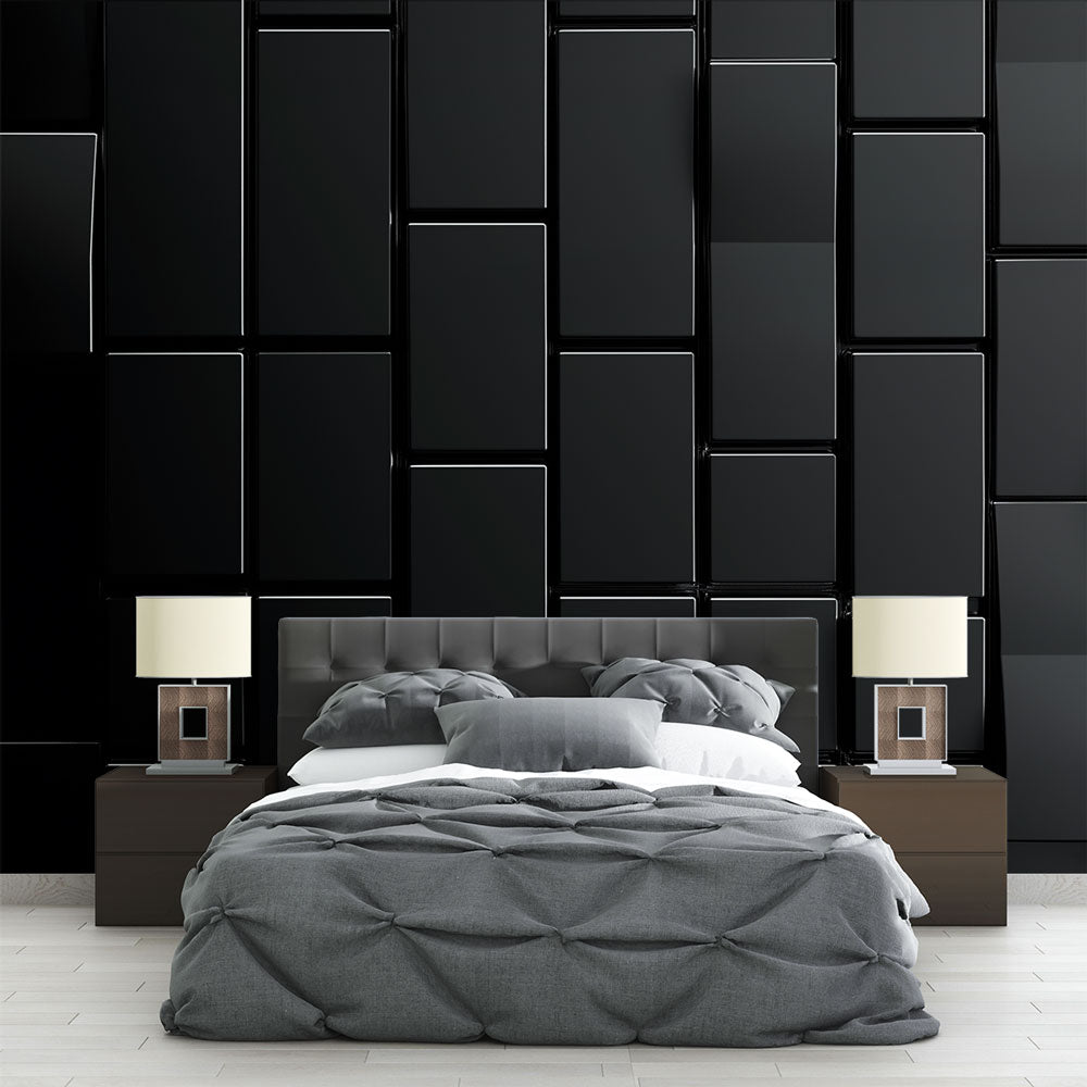 Modern black geometric wallpaper creating depth in a minimalist living room with sleek furniture and natural lighting