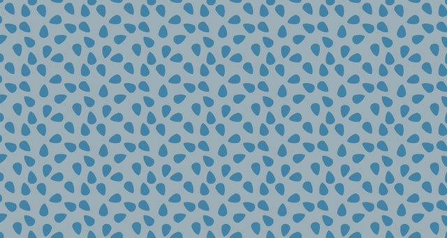 Modern geometric blue droplet wallpaper in a bright minimalist living room, creating a fresh and open atmosphere