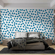 Modern geometric blue drops wallpaper in a bright contemporary home office showing flowing pattern and natural light