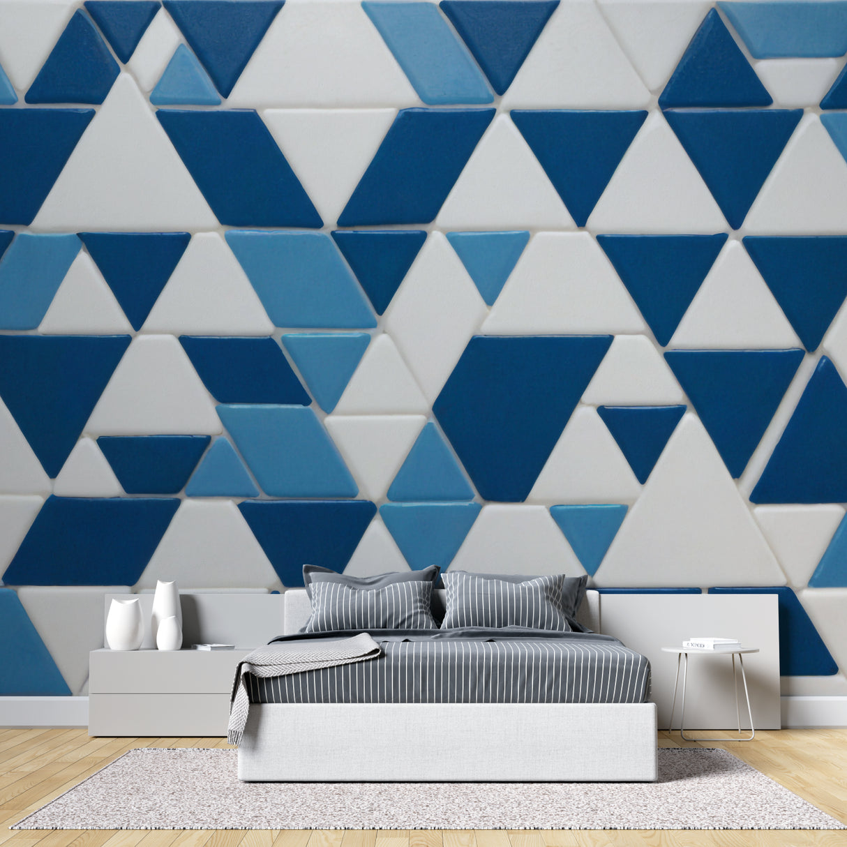 Modern blue geometric wallpaper in minimalist living room showing depth effect of triangle pattern