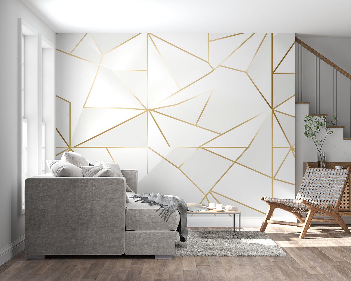 Bedroom wall with gold geometric pattern wallpaper showing soft metallic shine