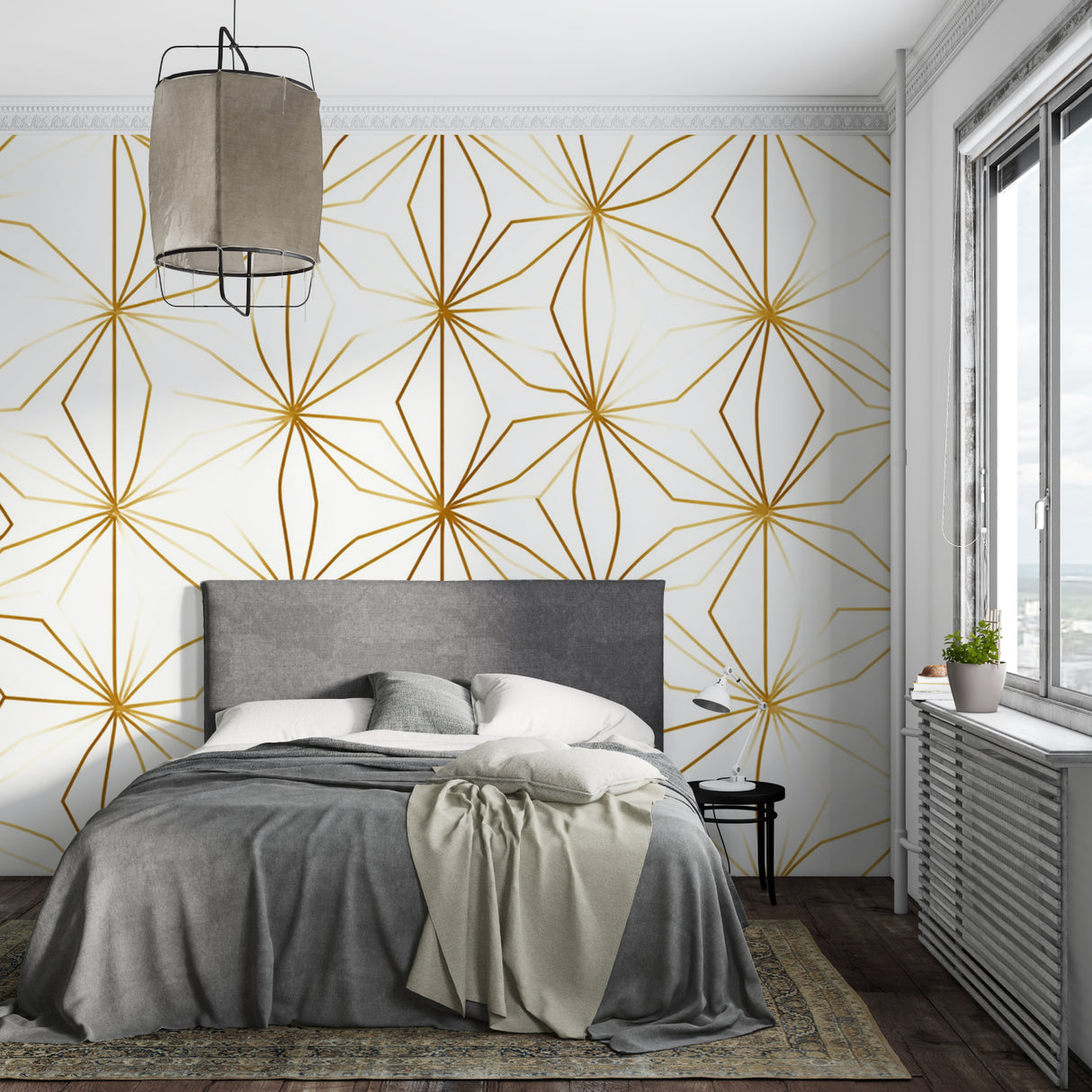 Modern gold geometric wallpaper in bright living room showing star pattern catching natural light