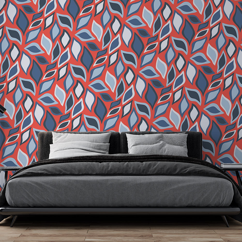 Modern geometric leaf pattern wallpaper in red and blue bringing life to a bright living room with contemporary furniture