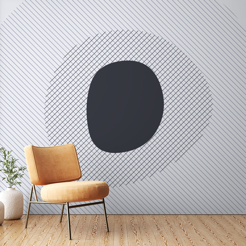 Modern geometric wallpaper creating depth in a minimalist living room with natural light and clean furniture arrangement