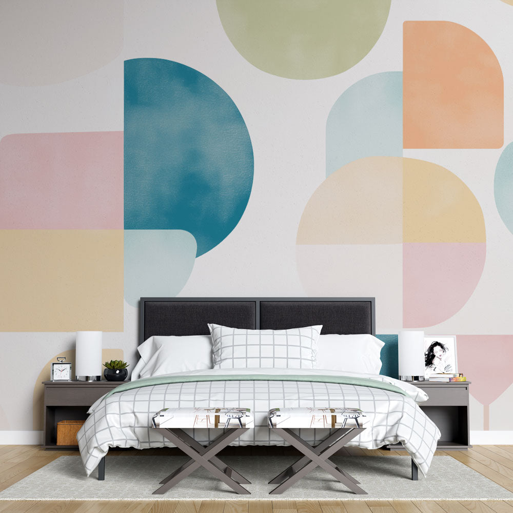 Modern geometric wallpaper with pastel shapes creating a fresh look in a bright Scandinavian living room setting