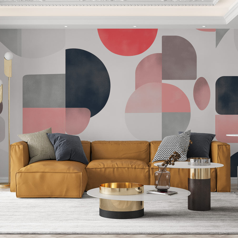 Modern geometric wallpaper with pink and grey circles creating depth in a bright, minimal living room setting