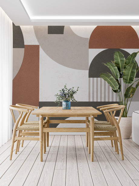 Modern geometric wallpaper in terracotta and grey tones styled in a bright Scandinavian living room