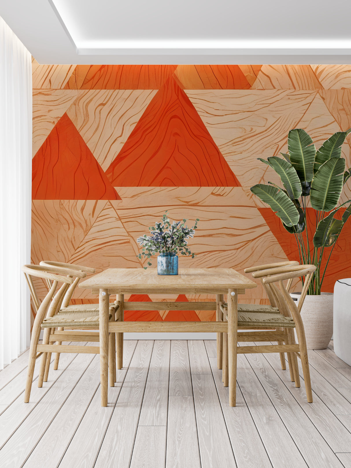 Orange geometric wall mural bringing warmth to a minimalist dining room space