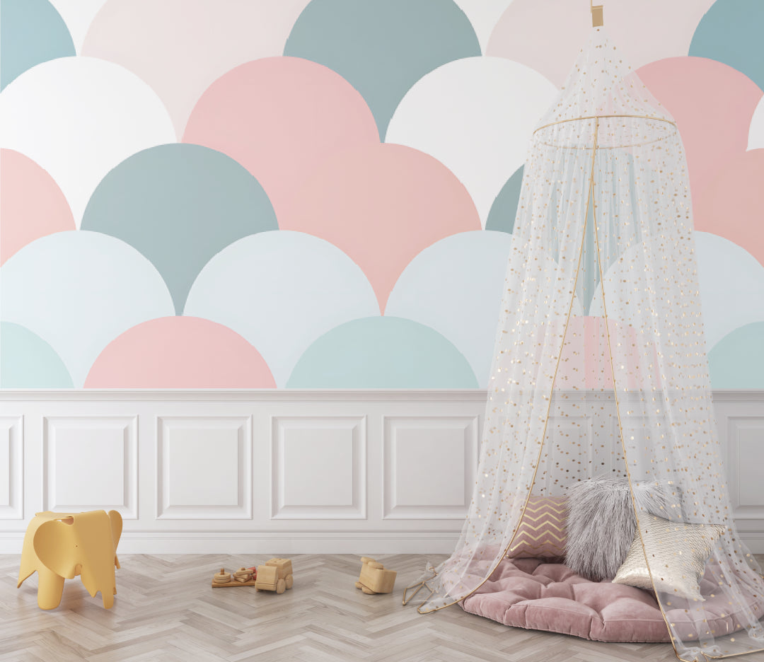 Pastel scallop wallpaper adding gentle movement to a reading corner with plush seating