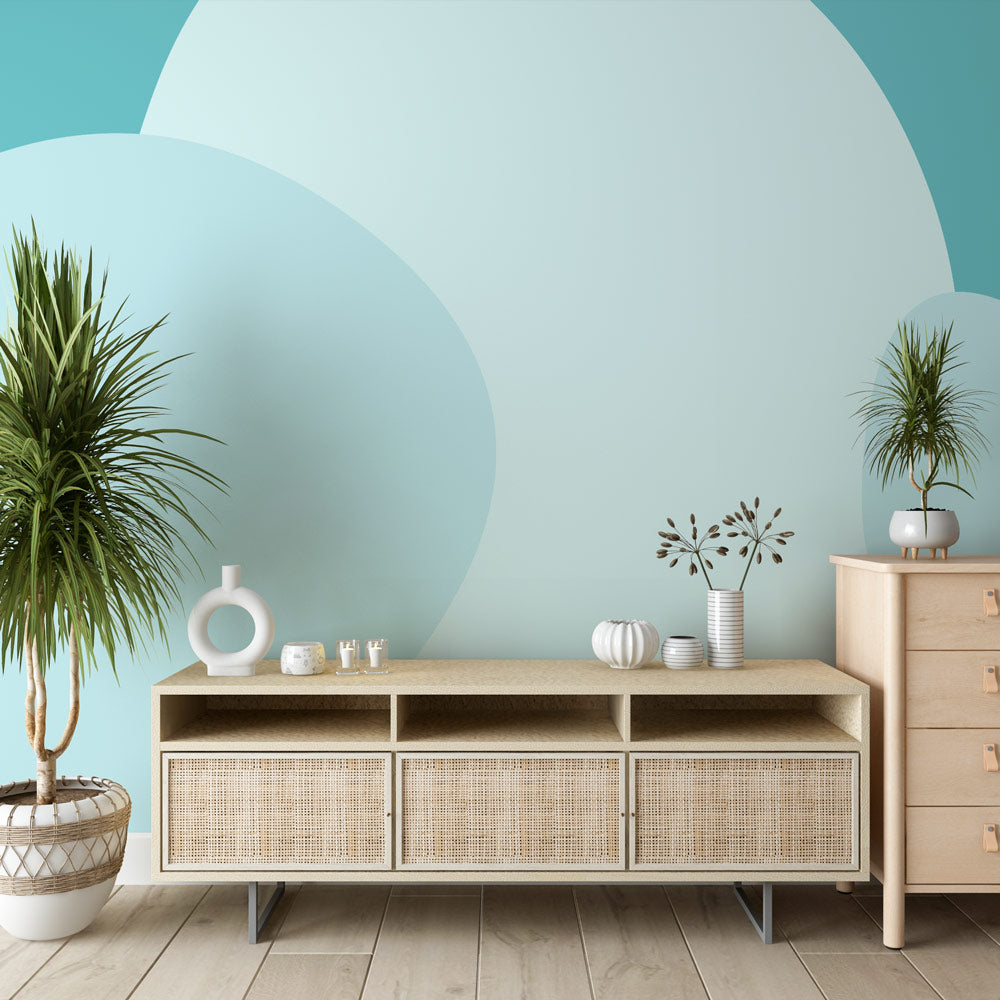 Modern geometric circle wallpaper creating a peaceful atmosphere in a minimalist living room with natural light