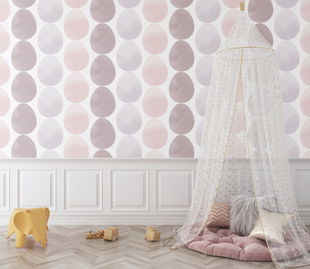 Geometric circle pattern wallpaper in girl's bedroom with pink accents and natural light