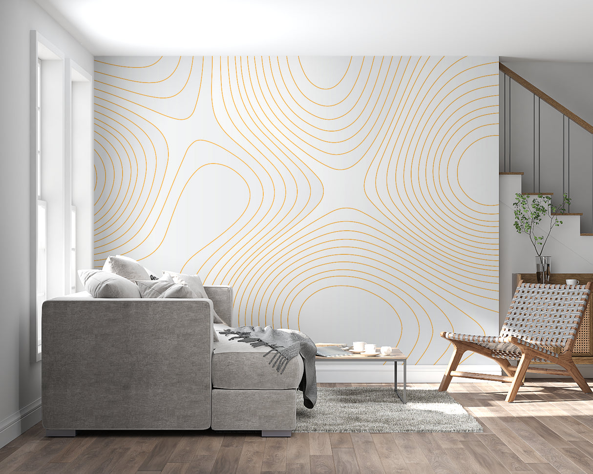 Geometric gold line art wallpaper in modern living room with minimalist furniture and natural light