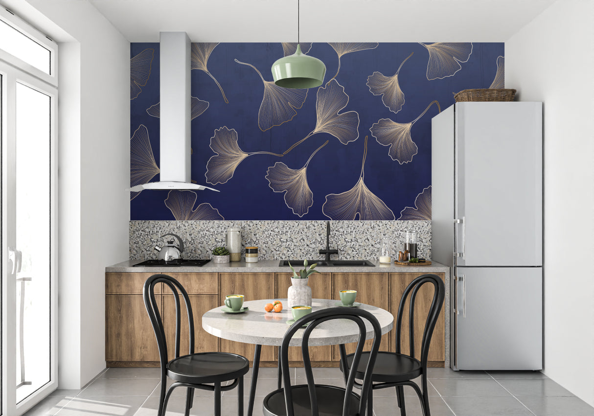 Botanical wallpaper featuring gold Ginkgo leaves in powder room with brass fixtures