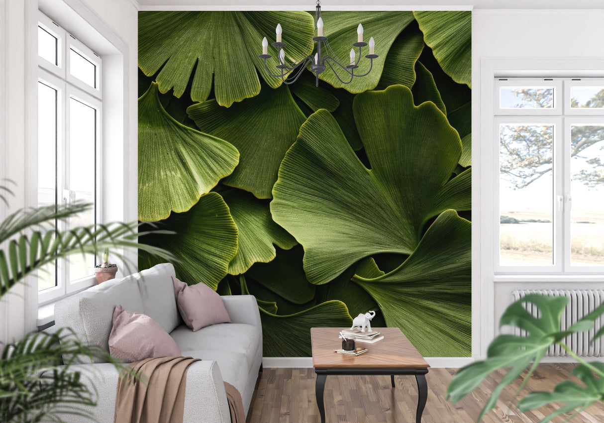 Ginkgo leaf wallpaper creating a fresh backdrop in a modern living room with natural light
