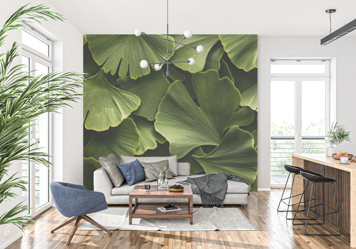 Green ginkgo leaf mural enhancing a minimalist dining room space