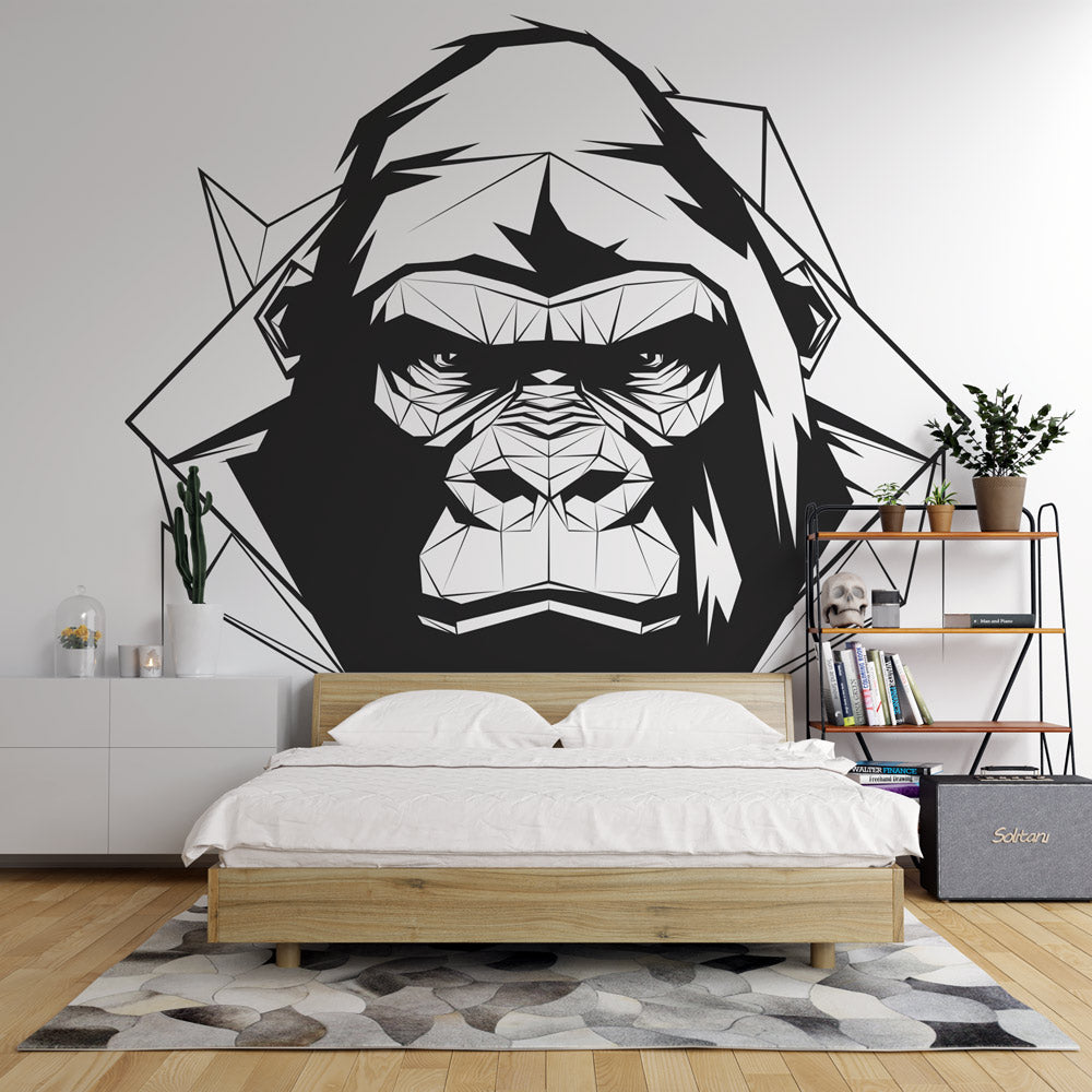 Geometric Gorilla Wallpaper creating a striking focal point in a modern minimalist office space with black furniture