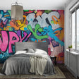 Graffiti wall mural bringing urban style to modern living room with colorful street art designs