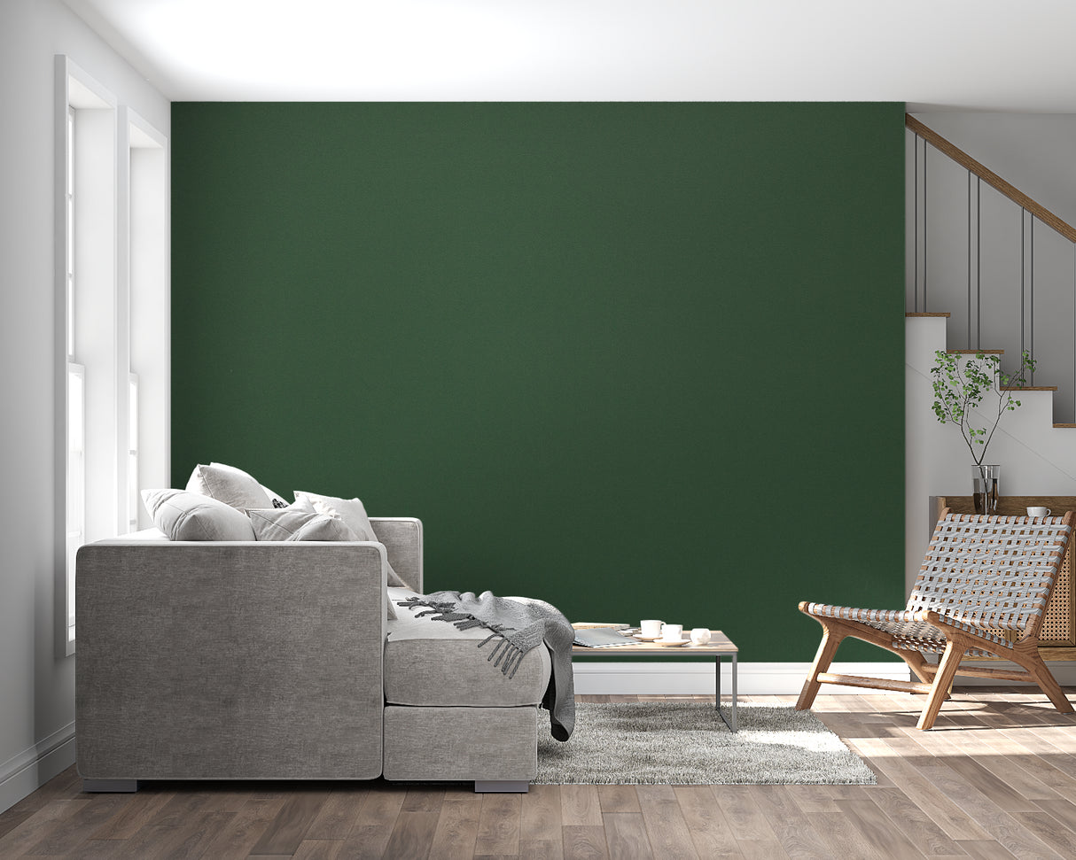 Forest green wallpaper creating a cozy atmosphere in a modern living room with natural light