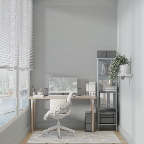 Modern grey wallpaper in a bright living room setting showing clean lines and minimal design