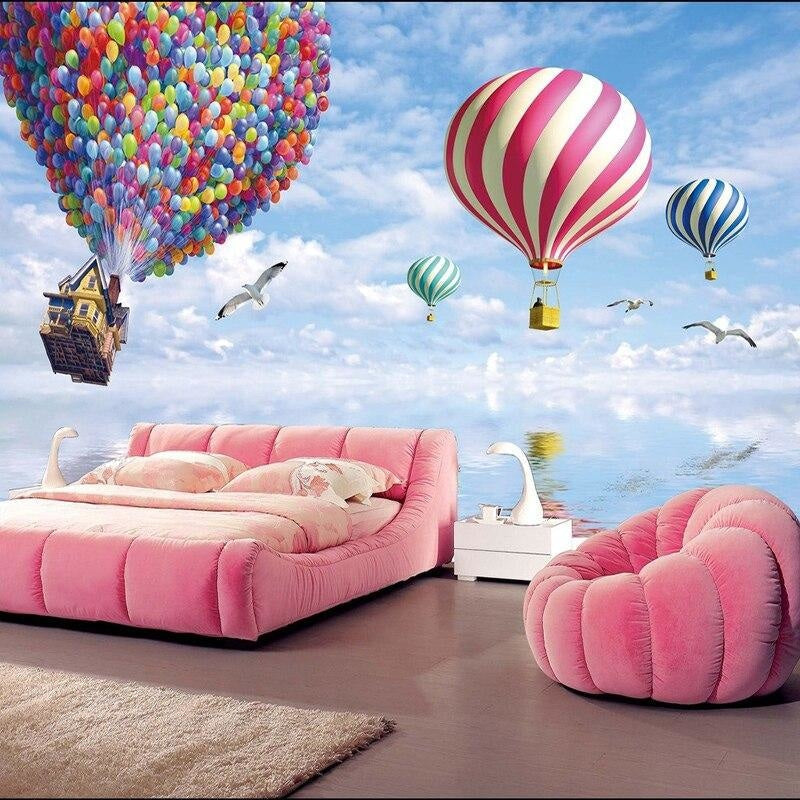 Hot air balloon wallpaper in bright nursery with white furniture showing floating house and colorful balloons