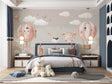 Hot air balloon nursery wallpaper in a bright modern nursery with white furniture