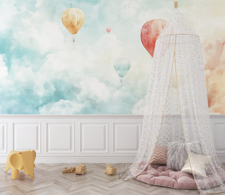 Hot air balloon wallpaper creating a dreamy atmosphere in a bright nursery with white furniture