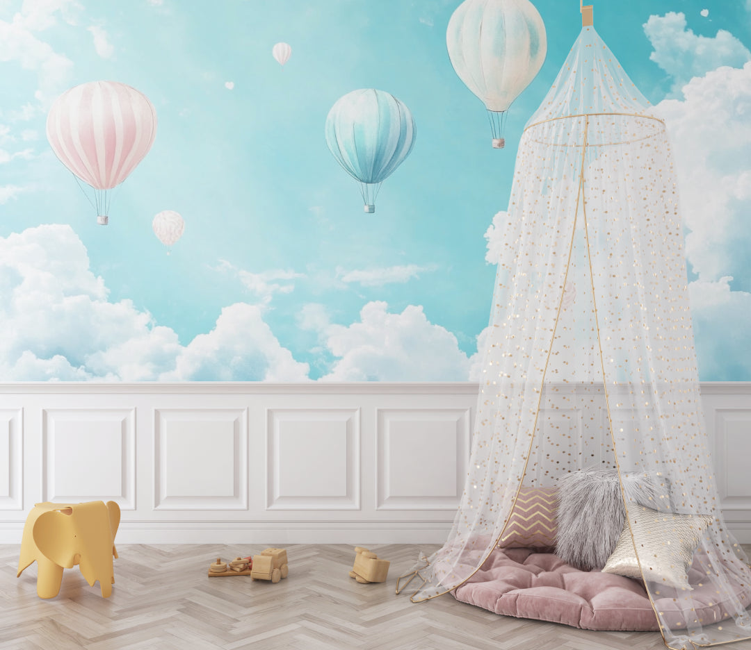 Hot air balloon wallpaper in bright nursery with white furniture, showing floating pastel balloons