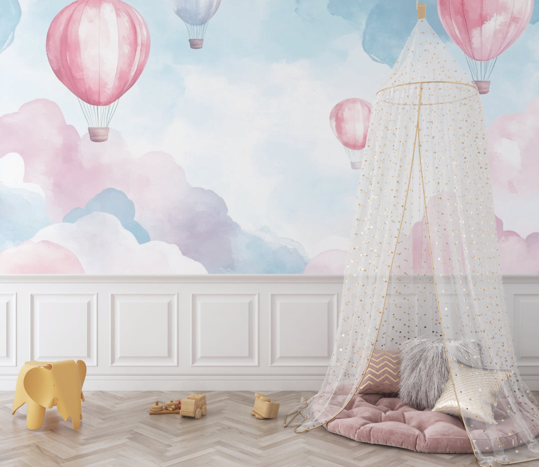 Hot air balloon wallpaper creating a dreamy atmosphere in a modern nursery with soft pink and blue tones