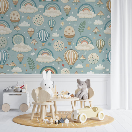 Hot air balloon wallpaper bringing magic to a cozy nursery with soft blue walls and white furniture
