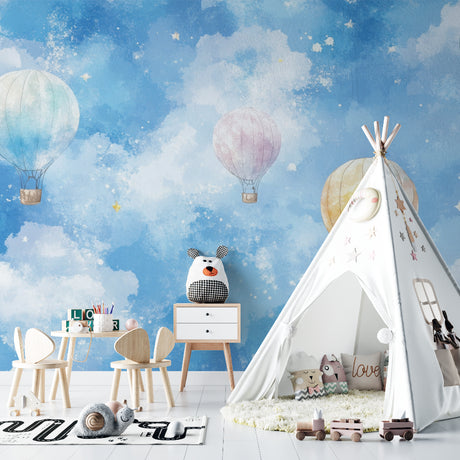 Hot air balloon wallpaper creating a dreamy atmosphere in a bright nursery with white furniture