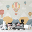 Hot air balloon nursery wallpaper bringing joy to a modern white nursery with pastel accents